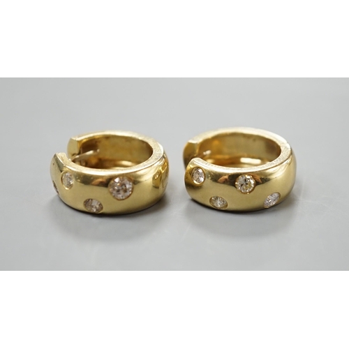 2973 - A modern pair of 750 yellow metal and four stone gypsy set diamond hoop earrings, 16mm, gross weight... 