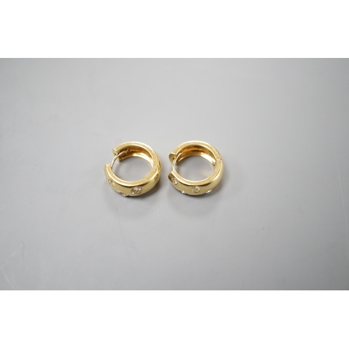 2973 - A modern pair of 750 yellow metal and four stone gypsy set diamond hoop earrings, 16mm, gross weight... 