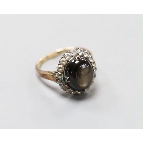 2974 - A 14k yellow metal, star sapphire and white sapphire? set oval cluster ring, size N, gross weight 4.... 