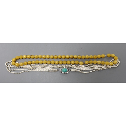 2976 - A multi-strand 'rice pearl' necklace with 18k white metal and turquoise set clasp, 66cm and an amber... 