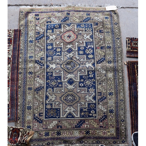 113 - An antique Caucasian Derbend rug, 160 x 108cm, a smaller red ground rug and rug fragments