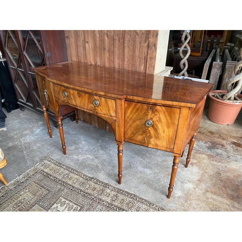 115 - A Regency mahogany bowfront sideboard, length 184cm, depth 75cm, height 93cm