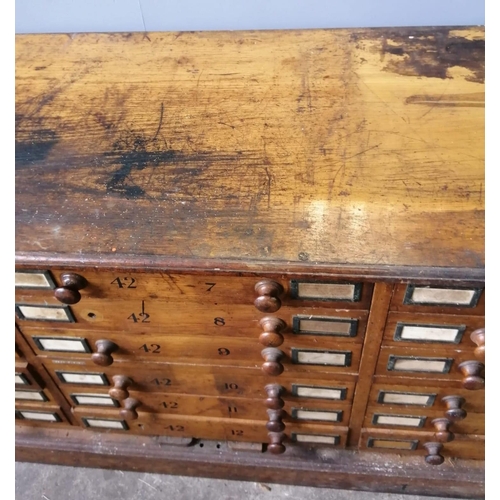 121 - A large Victorian oak geological specimen cabinet, fitted 18 drawers with side locking bars, width 1... 