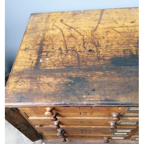 121 - A large Victorian oak geological specimen cabinet, fitted 18 drawers with side locking bars, width 1... 