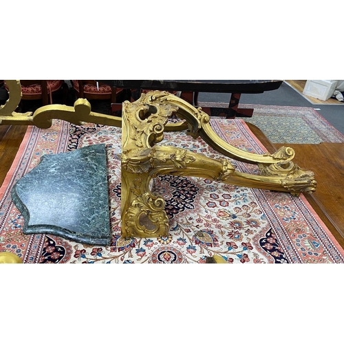 131 - A pair of 18th century style carved giltwood serpentine console tables with variegate green marble t... 