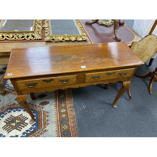 140 - A mid 18th century style two drawer oak dresser base, width 121cm, depth 39cm, height 83cm