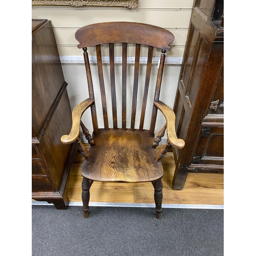 153 - A Victorian elm and beech Windsor lathe back armchair, width 60cm, depth 46cm, height 109cm