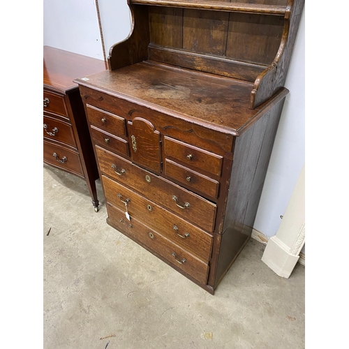 19 - An 18th century oak chest of drawers with later associated oak shelves, width 79cm, depth 46cm, heig... 