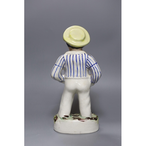 257 - A Staffordshire pottery figure of a sailor, 33 cms high,