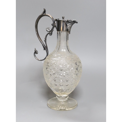 260 - An electroplate mounted cut glass claret jug, 29 cms high,