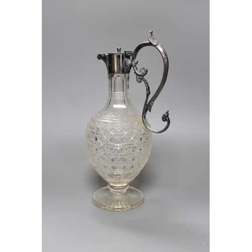 260 - An electroplate mounted cut glass claret jug, 29 cms high,