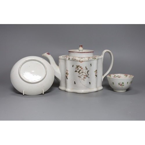 261 - A New Hall type teapot and a similar tea bowl and saucer,teapot 15 cms high,