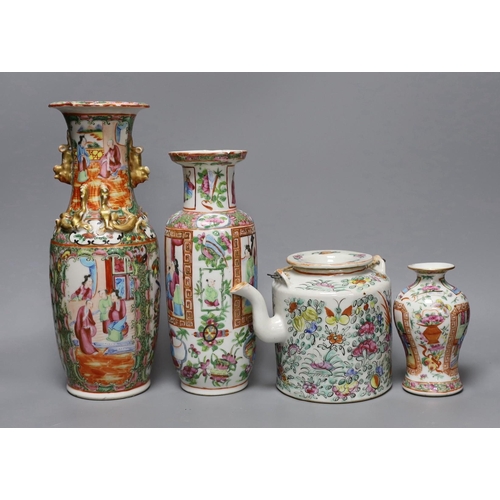 265 - Three Chinese famille rose vases and a teapot, late 19th/early 20th century, tallest vase 29.5 cms h... 