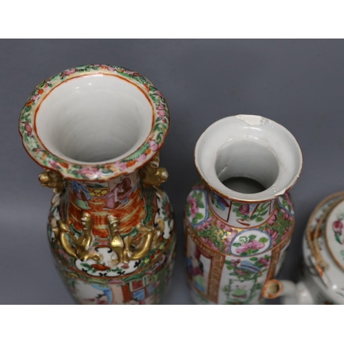 265 - Three Chinese famille rose vases and a teapot, late 19th/early 20th century, tallest vase 29.5 cms h... 