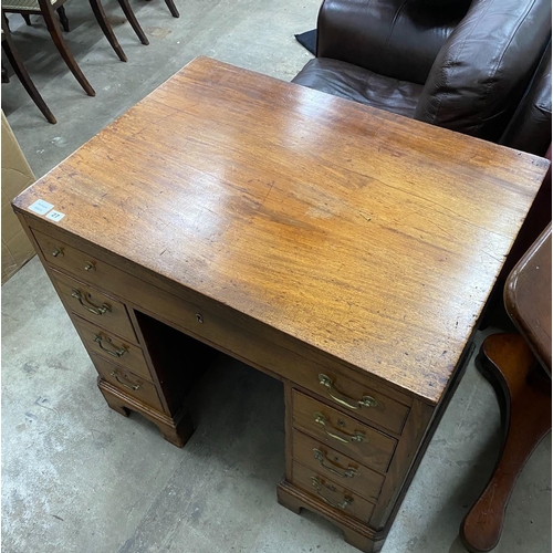 27 - A George III mahogany kneehole desk, width ,depth 65cm, height 79cm