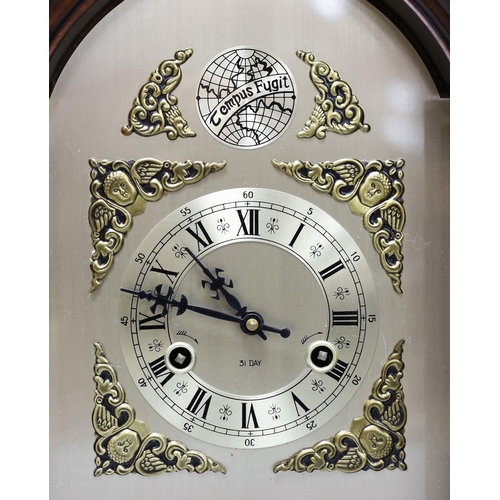 271 - A 1950's 31 day mantel clock, 36 cms high,