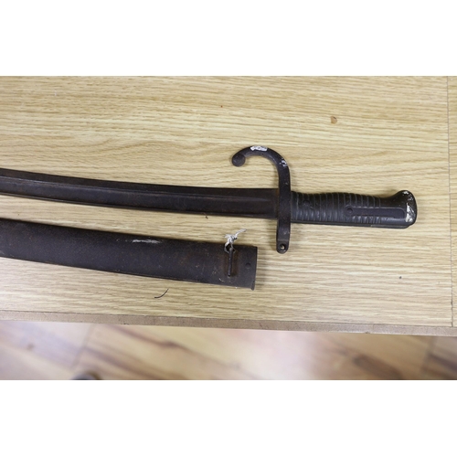 276 - A Victorian Metropolitan police truncheon and a bayonet,truncheon 43 cms long,