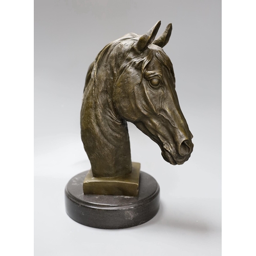 289 - After Barye, a bronze of a horse's head on plinth base, 32cm tall