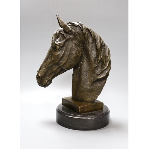 289 - After Barye, a bronze of a horse's head on plinth base, 32cm tall