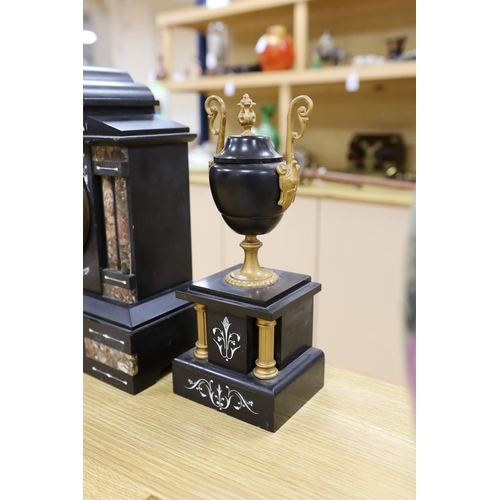 294 - A black slate and marble clock garniture,clock 33cms high,