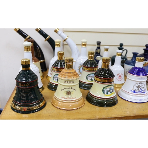 299 - Four Wade commemorative porcelain 70cl bottles of Bells whisky, a miniature porcelain bottle of bell... 