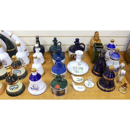 299 - Four Wade commemorative porcelain 70cl bottles of Bells whisky, a miniature porcelain bottle of bell... 