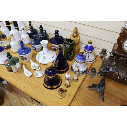 299 - Four Wade commemorative porcelain 70cl bottles of Bells whisky, a miniature porcelain bottle of bell... 