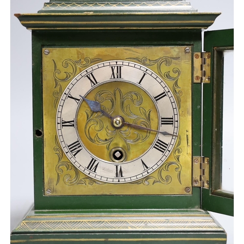 302 - A 1920's green japanned mantel timepiece,26 cms high,