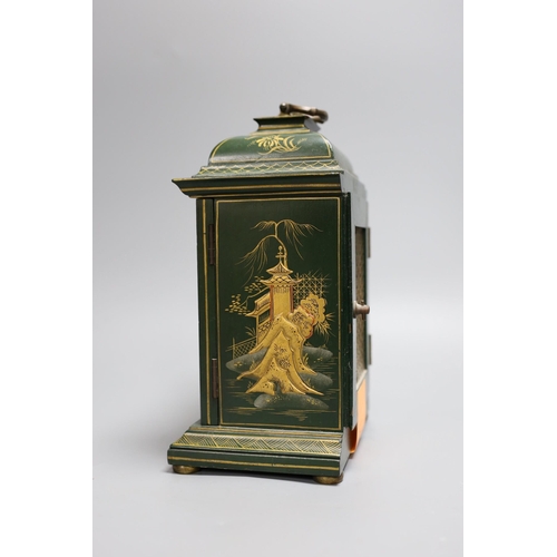 302 - A 1920's green japanned mantel timepiece,26 cms high,