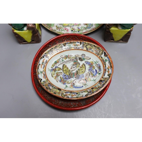 307 - A Cantonese famille rose plate and teapot with cover, a pair of Chinese seated dogs, and a tureen wi... 