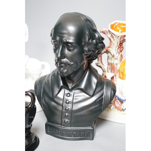 309 - A Wedgwood glazed black basalt bust of Shakespeare, two Victorian Staffordshire figures and a cow cr... 