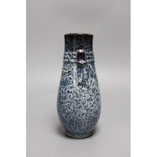 330 - A Chinese Shiwan vase, 23 cms high,