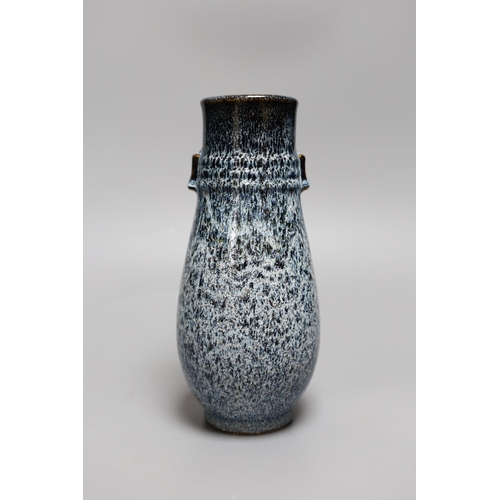 330 - A Chinese Shiwan vase, 23 cms high,