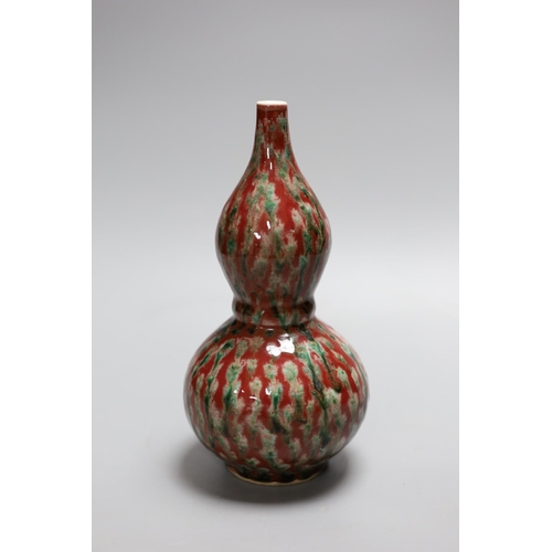 337 - A Chinese flambé double gourd vase,21 cms high,