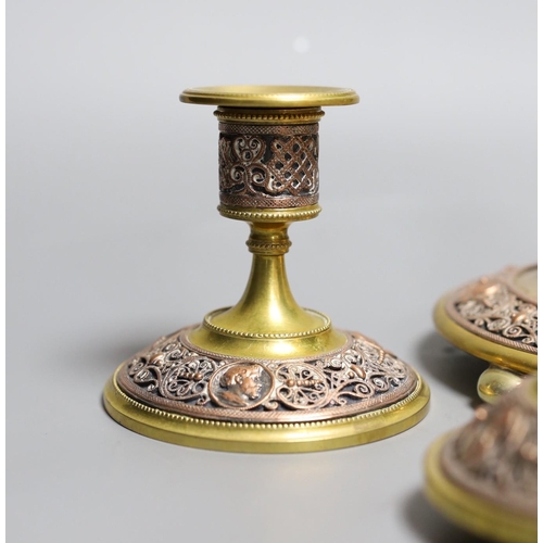 353 - A brass and filigree worked copper desk set (4),inkwell 10.5 cms high,