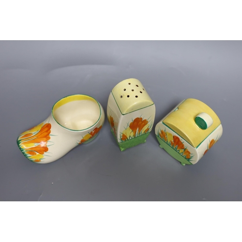 362 - A Clarice Cliff sungleam crocus, jam pot and cover, a sugar shaker and a Dutch clog ornament (3),jam... 