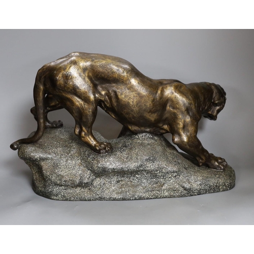 389 - After Thomas François Cartier (1879-1943) patinated spelter model of a tiger, 49cm long