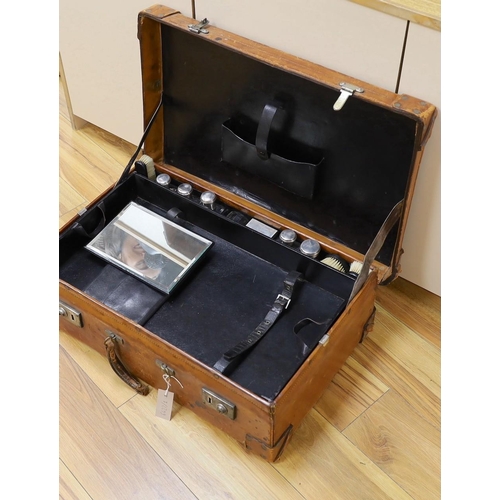 396 - A Dupont travel suitcase, initialled L.C. with French white metal mounted bottles