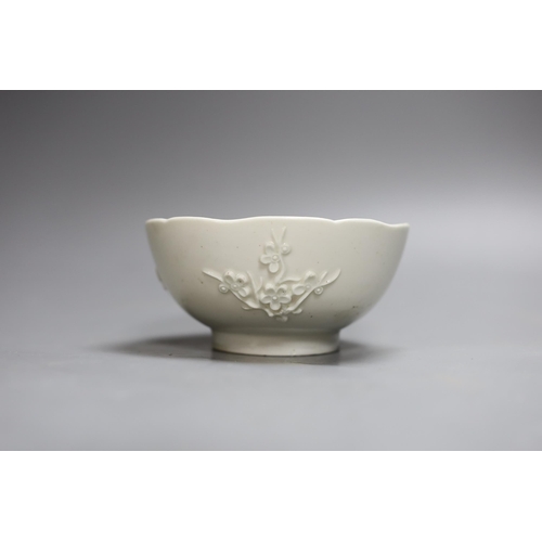 401 - An 18th century Bow white glazed prunus bowl, and a Bow octagonal plate, with floral design, 21cm ... 