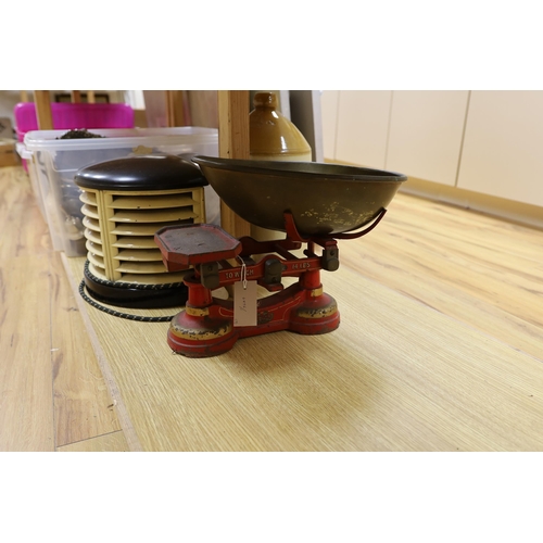 406 - A 1930's HMV bakelite electric heater, A Mattocks cast iron weighing scale and a Lewes stoneware jar... 