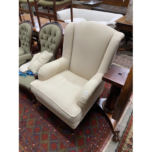 42 - A modern Wesley-Barrell upholstered armchair