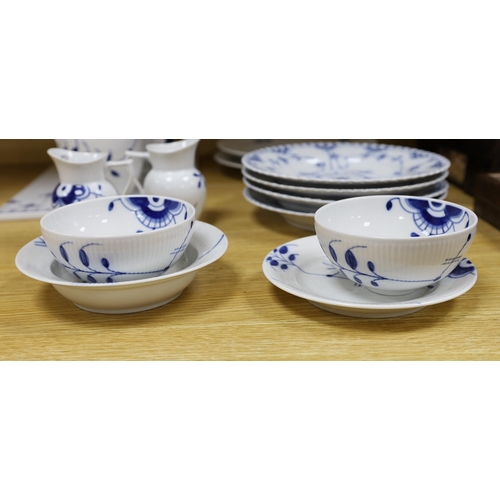 422 - A collection of varying patterns of Royal Copenhagen blue and white tableware,