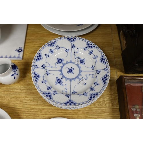 422 - A collection of varying patterns of Royal Copenhagen blue and white tableware,