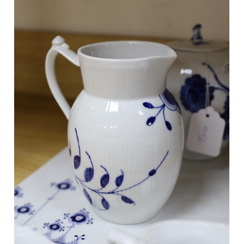 422 - A collection of varying patterns of Royal Copenhagen blue and white tableware,