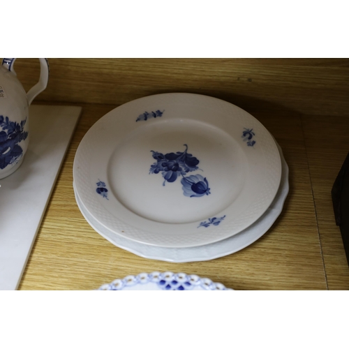 422 - A collection of varying patterns of Royal Copenhagen blue and white tableware,