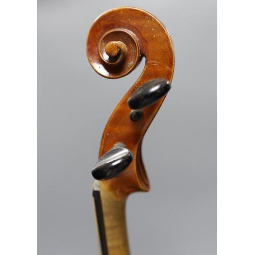 431 - An early 20th century cased violin, length of back 36 cm