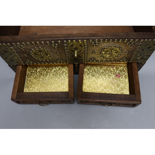 432 - An Indian brass studded and mounted box, 45cms wide x 21cms high,