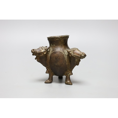 455 - An Indian bronze ox monopdia vessel, 11cms high,