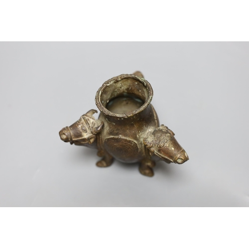 455 - An Indian bronze ox monopdia vessel, 11cms high,