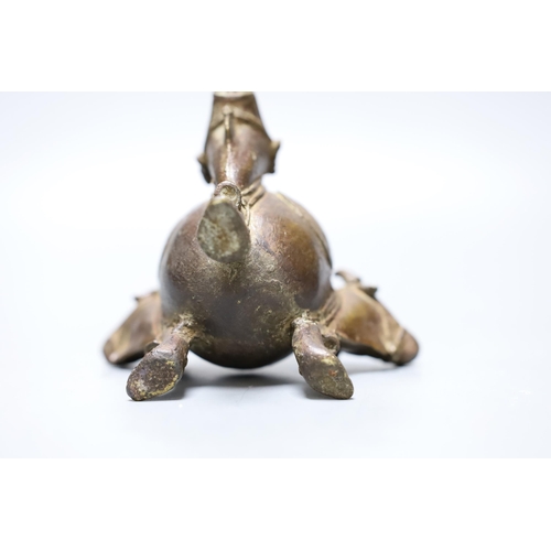 455 - An Indian bronze ox monopdia vessel, 11cms high,